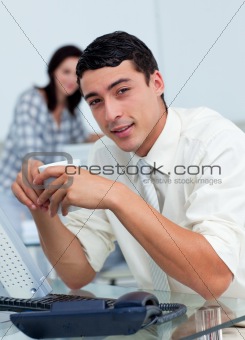 Young businessman drinking a coffee 