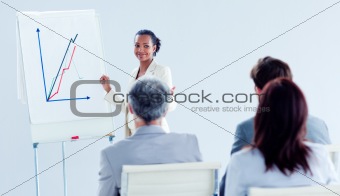 Smiling ethnic businesswoman doing a presentation 
