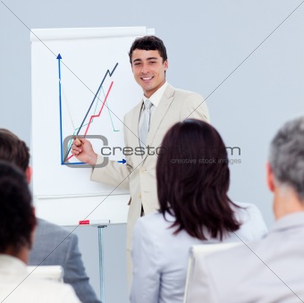 Positive young businessman doing a presentation