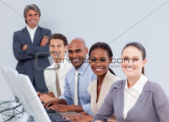 Positive business people working in a call center