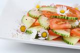 Vegetable salad with daisies