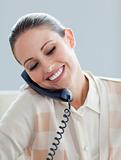 Assertive businesswoman talking on phone