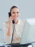 Enthusiastic businesswoman talking on phone