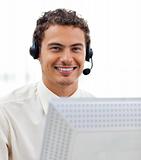 Latin young businessman with headset on 