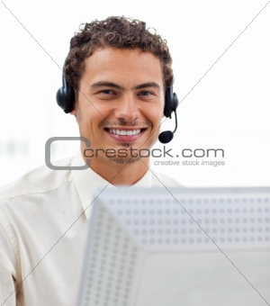 Latin young businessman with headset on 