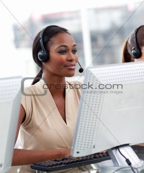 Serious ethnic businesswoman working in a call center