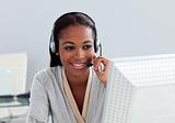 Assertive ethnic customer service agent with headset on 