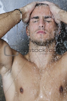 good looking man under man shower