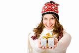 Young happy woman with winter cap holds gift in hands