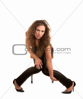 Pretty woman in black seated on orange office chair