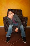 Handsome Young Hispanic Seated in Colorful  Chair