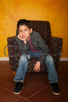 Handsome Young Hispanic Seated in Colorful  Chair