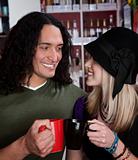 Interracial couple toasting with coffee cups