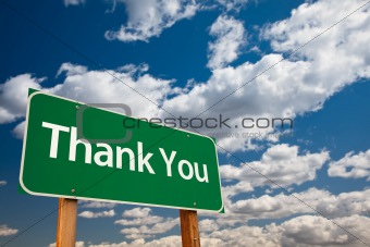 Thank You Green Road Sign with Copy Room Over The Dramatic Clouds and Sky.