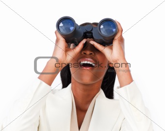 Surprised businesswoman looking through binoculars 