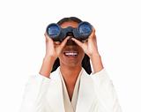 Visionary businesswoman looking through binoculars 
