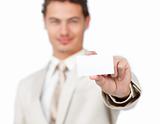Young businessman holding a white card 