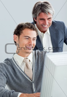 Portrait of two business colleagues working at a computer