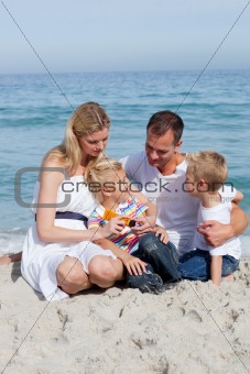 Caring mother with her family holding sunscreen