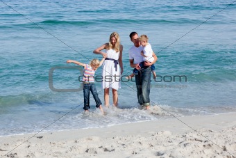 Lively family having fun at the beach