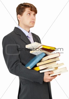 Student holds a lot of books