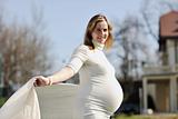 happy young pregnant woman outdoor