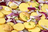 Raw potatoes with red onion, garlic and parsley