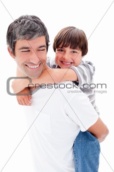 Close-up of father giving his son piggyback ride