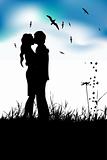 Couple kissing on summer meadow, black silhouette