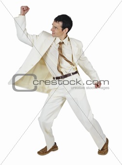 Fighting businessman puts a punch, isolated on white