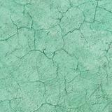 Texture of green concrete wall with cracks