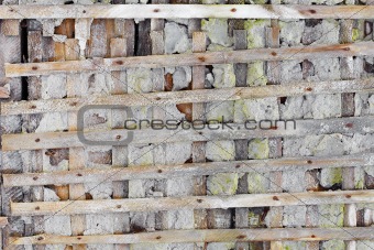 Ruined wall with wooden lattice - background