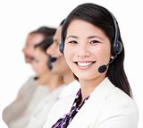 Cheerful business people with headset on standing