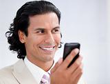 Happy businessman using a mobile phone