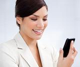 Charming businesswoman using a mobile phone