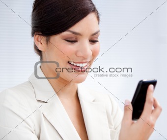 Charming businesswoman using a mobile phone