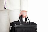Close-up of a businesswoman holding a briefcase