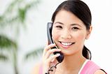 Portrait of a cheerful businesswoman talking on phone 