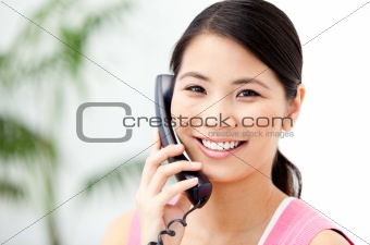 Portrait of a cheerful businesswoman talking on phone 