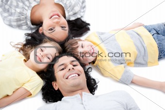 Cute family lying on the floor together
