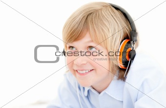 Portrait of a cute boy listenning music