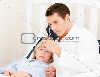 Handsome male doctor examining a child