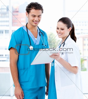 Happy medical partners looking at the diagnosis