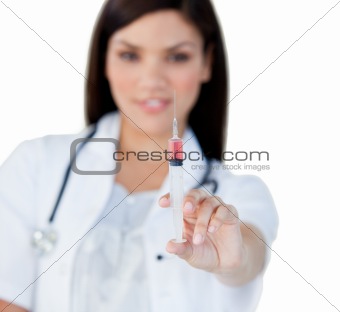 Professionnal female doctor holding a syringe 