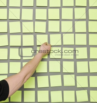 Hand and Adhesive Notes