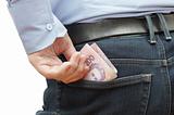 Man hiding money into his hip pocket