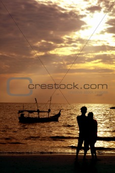 loving couple on beach at sunset