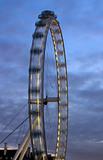 Fragment of the London Eye at night with motion and dark blue sky