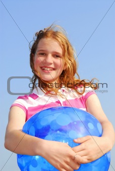 Young girl with beach ball
