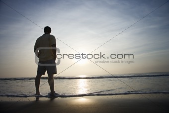 Man alone on beach.